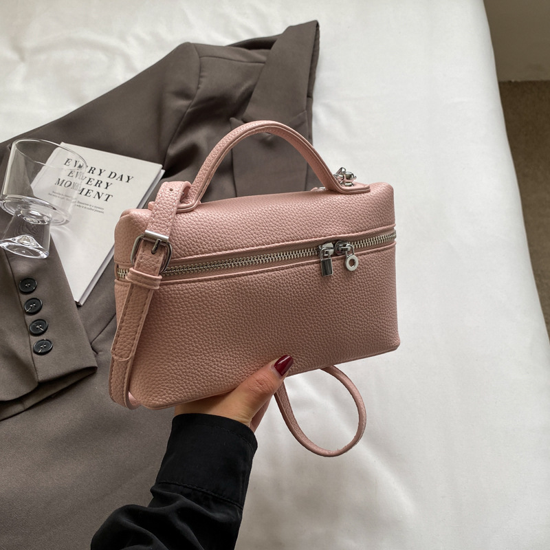 A niche hand-held lunch box bag for women in 2025, featuring a single-shoulder crossbody bag with lychee patterns, a three-dimensional small square bag, and a fashionable box bag details Picture