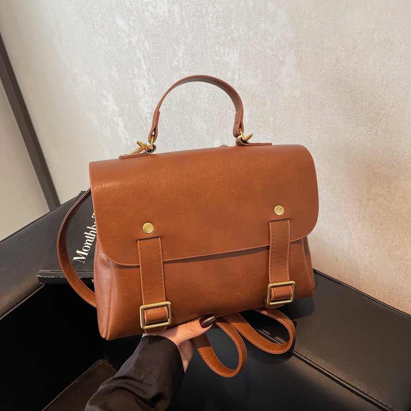 This is a new 2024 retro casual hand-held Japanese student backpack with a large capacity for women. It is a high-end travel backpack details Picture