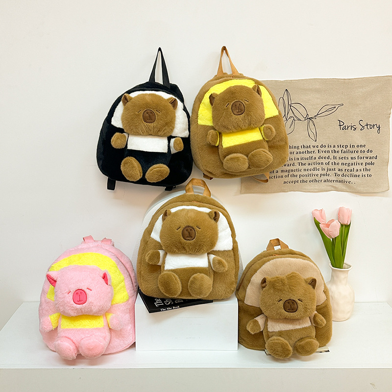 The new cartoon teddy bear is cute and versatile. It's a plush double-shoulder toy bag. The claw machine doll teddy bear can be exchanged for a capybara bag full figure