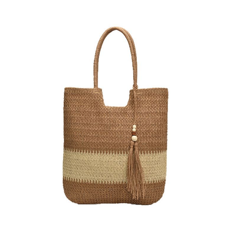Seaside beach vacation straw woven bag for women 2025 New style hollowed-out color-blocked single-shoulder bag with tassels and large capacity bucket bag Item Picture