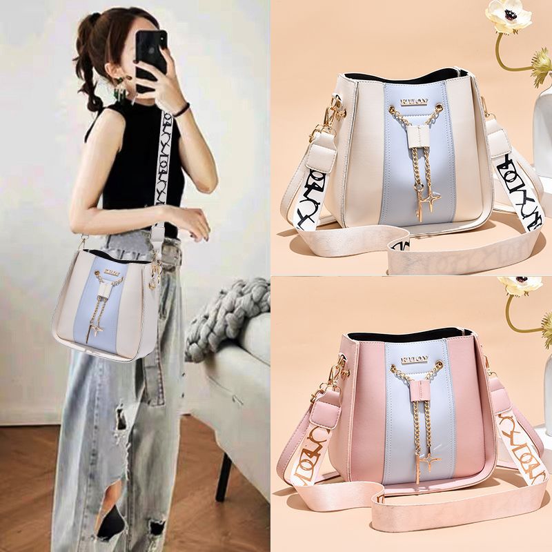 The 2022 new trendy and high-end women's bucket bag from Instagram is a color-blocking wide-band crossbody bag details Picture