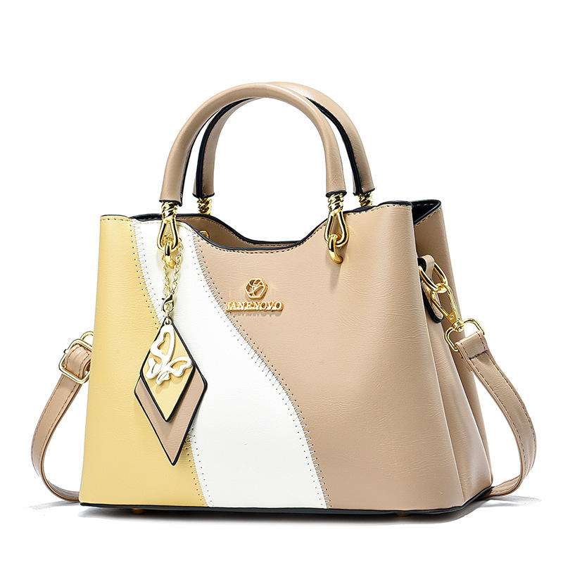 This is a new high-end Korean-style trendy handbag for women in spring 2024. It features a sweet and elegant style with a color-blocking design and a crossbody bag Application Scenario