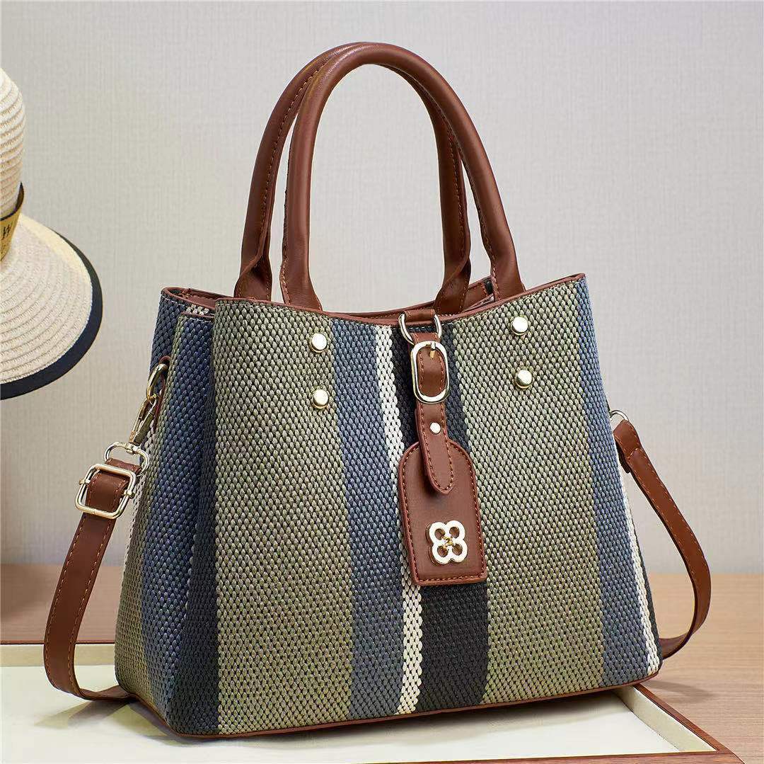 The 2023 new hand-held crossbody single-shoulder bag for foreign trade women is a fashionable cross-border bag with woven and embossed patterns. It has a large capacity and contrasting colors Specification drawing
