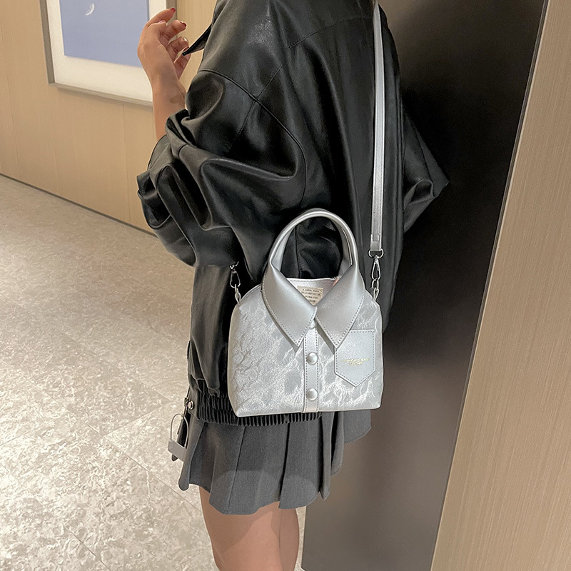 The 2025 summer new Korean-style fashionable and simple hand-held shoulder bag with a high-end and personalized design for women's commuting crossbody Application Scenario