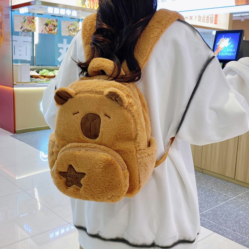 The new Capibara plush Capybara backpack 2024 is cute and versatile. It's a cute plush bag for girls and cartoon students details Picture