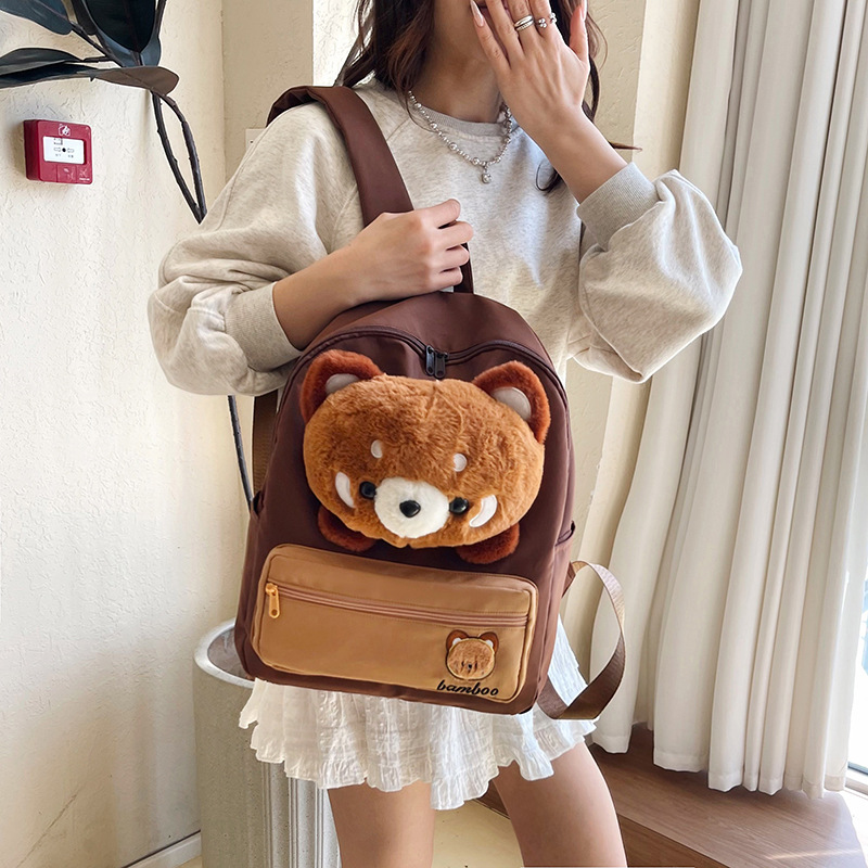 The new cartoon bear canvas backpack is cute and has a large capacity. It's a student class backpack with a girlish heart and a little lamb style details Picture