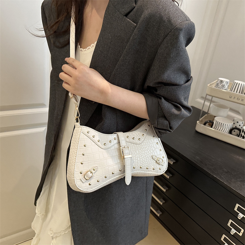 Rivet simple and retro 2025 summer personalized new fashion solid color trendy casual shoulder bag, underarm bag for women details Picture