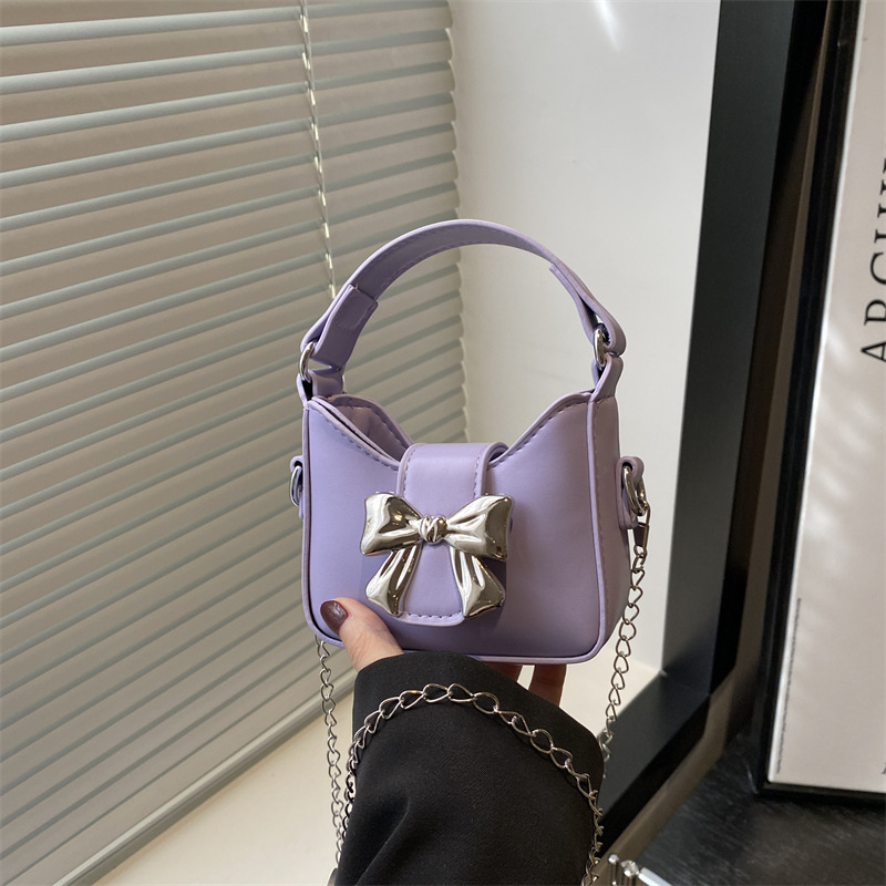 Niche bow handbag, 2025 new Korean version mini chain crossbody bag, fashionable lipstick, headphones, single-shoulder bag full figure