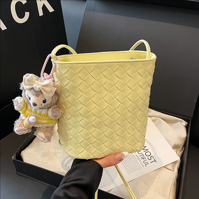 The 2025 new high-end woven mini bucket bag is a simple and stylish single-shoulder crossbody bag for women's fashion in solid color full figure