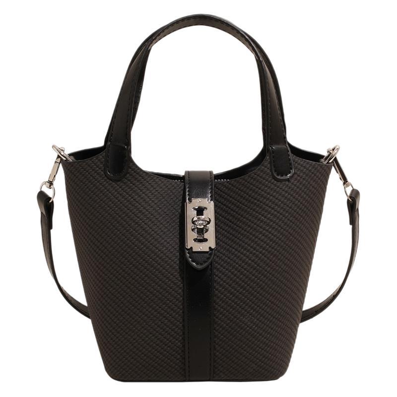 A Korean version of a niche mother-and-child bag with a simple lock buckle hand-held bucket bag for women, a new 2025 daily commuting single-shoulder crossbody bag Item Picture