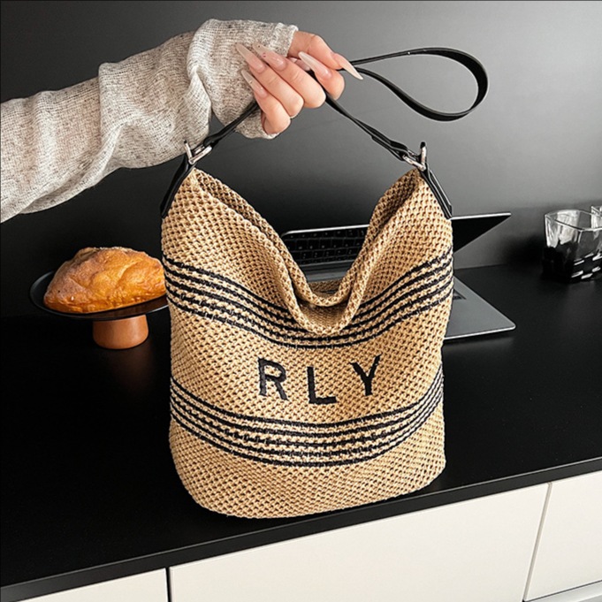 2025 Summer new style patchwork hand-woven letter straw bucket bag for women, fashionable seaside vacation single-shoulder crossbody bag full figure