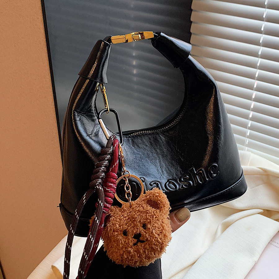 Retro and fashionable hand-held pea bag for women, 2024 new simple and casual single-shoulder bag, niche design, high-end women's bag full figure
