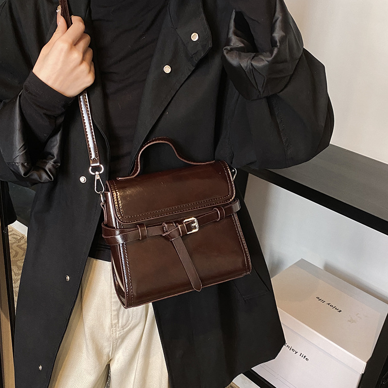 A new 2024 trendy and versatile women's handbag with a Kelly strap, a small square crossbody bag with a belt and strap details Picture