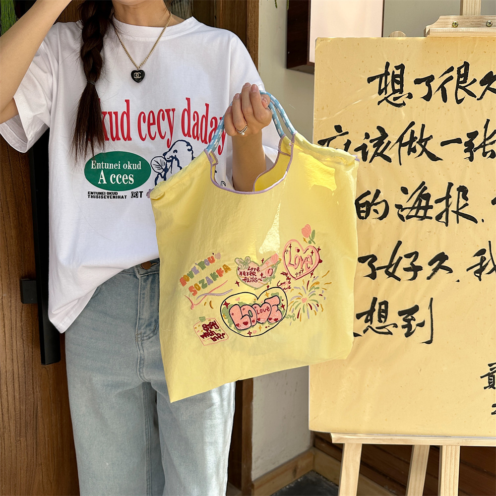 4683 ins Sweet Women's embroidered shopping bags, hand-held bags, Oxford cloth bags, handbags, student class handbags details Picture