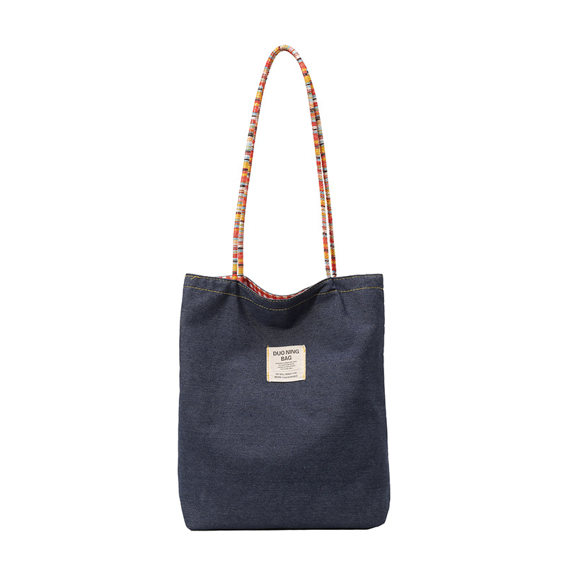 A new summer 2025 casual tote bag for college students, featuring a double-sided checkered backpack and a unique artistic style Item Picture