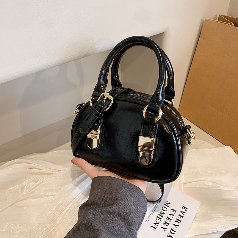 Korean niche hand-held bowling bag for women, 2024 new trendy and fashionable shell bag, versatile solid color crossbody bag details Picture