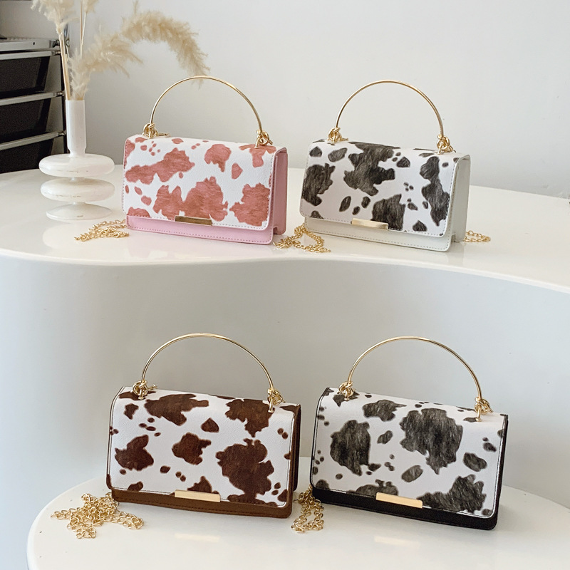 This is a retro and fashionable cow print handbag from Europe and America. It is a new style for women's summer 2025, featuring a high-quality commuting single-shoulder crossbody bag Application Scenario