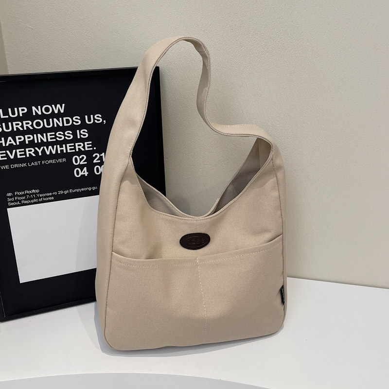 New large-capacity simple canvas bags, single-shoulder underarm bags for students' classes, niche fashion and versatile tote bags wholesale full figure