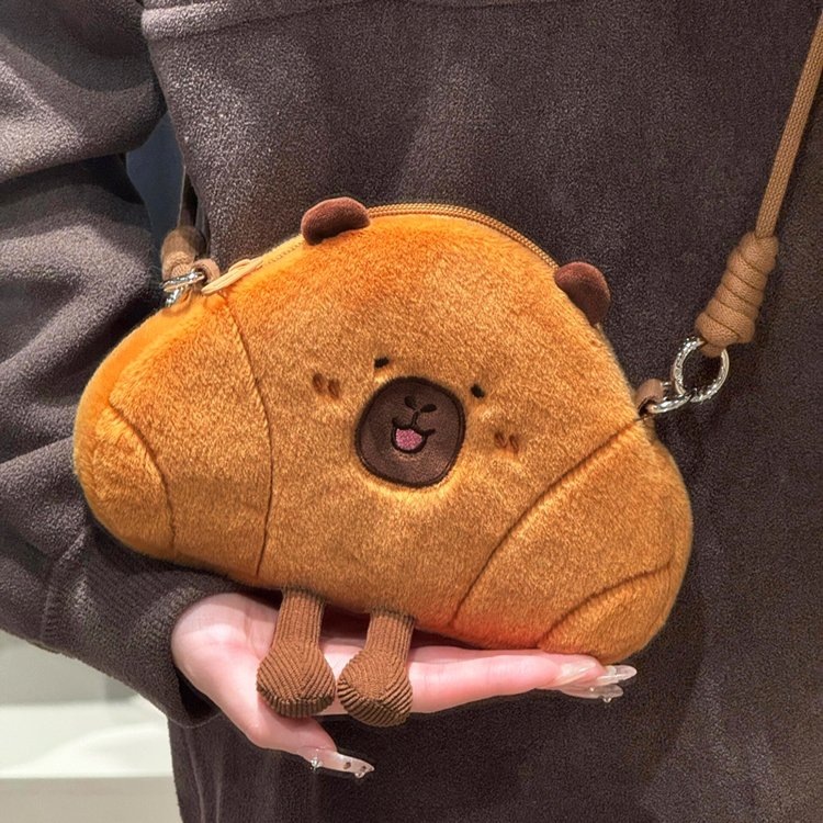 The horned capybara crossbody bag, a cute plush toy single-shoulder bag, an ugly and adorable water guinea pig doll crossbody bag full figure