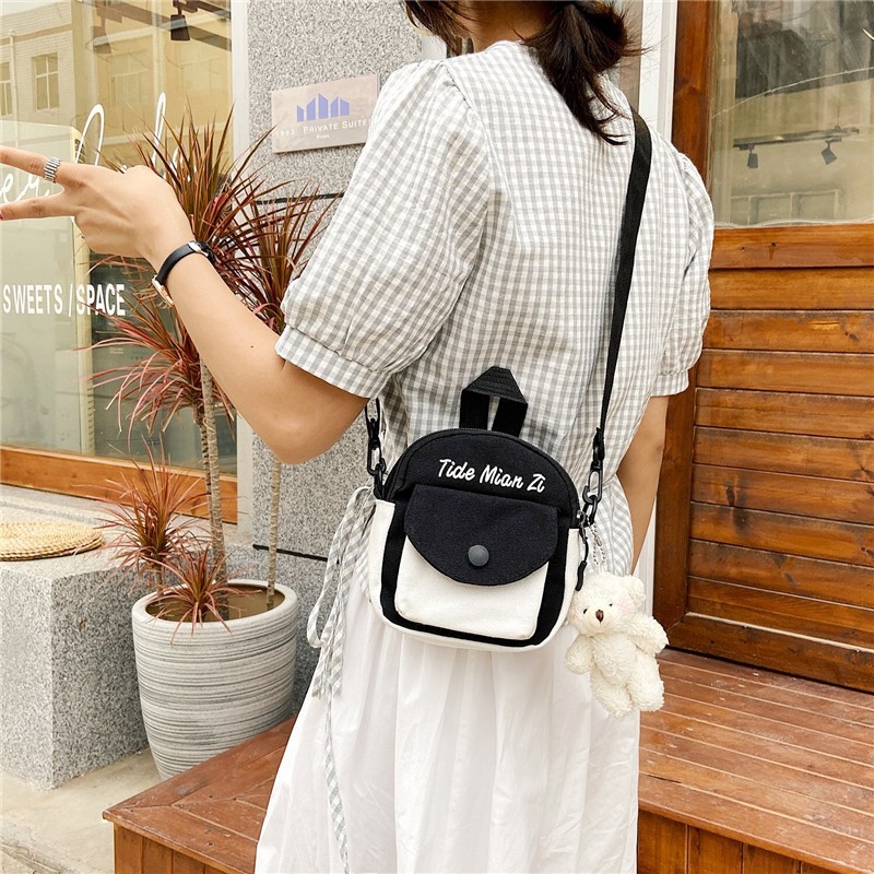 A trendy canvas bag for women in 2020, featuring a unique crossbody style for female students. It's a Korean-style, fresh and clean single-shoulder bag details Picture