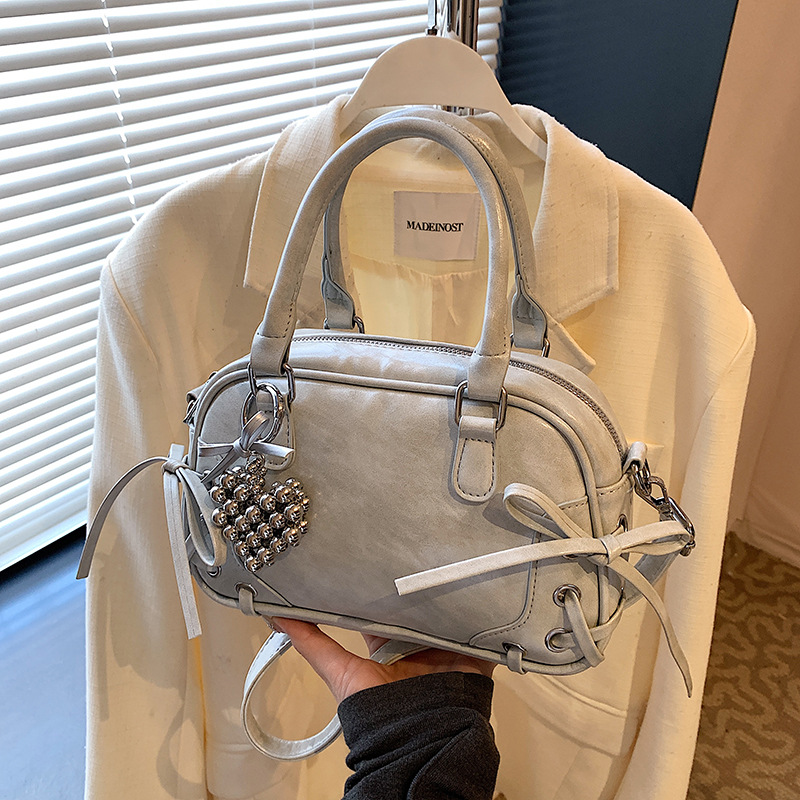 A stylish and sweet bow hand-held Boston bag for women, a new style of high-quality commuting versatile single-shoulder crossbody bag for 2025 full figure