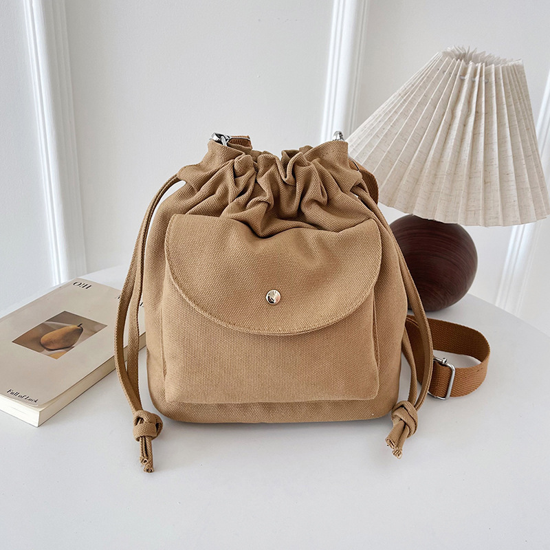 Canvas bag for women's Spring/Summer 2025 new Korean style fashionable pleated drawstring crossbody bag, high-end commuter bucket bag full figure