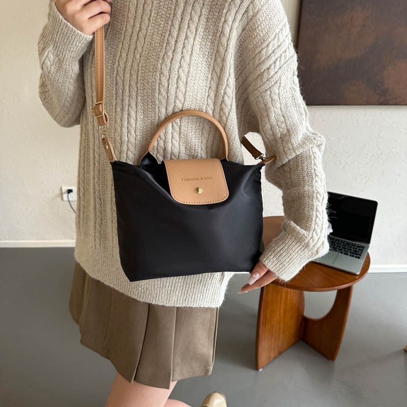 This year, Oxford small bags are in fashion. The 2023 new trendy color-blocking crossbody bag, dumpling bag, casual and fashionable handbag details Picture