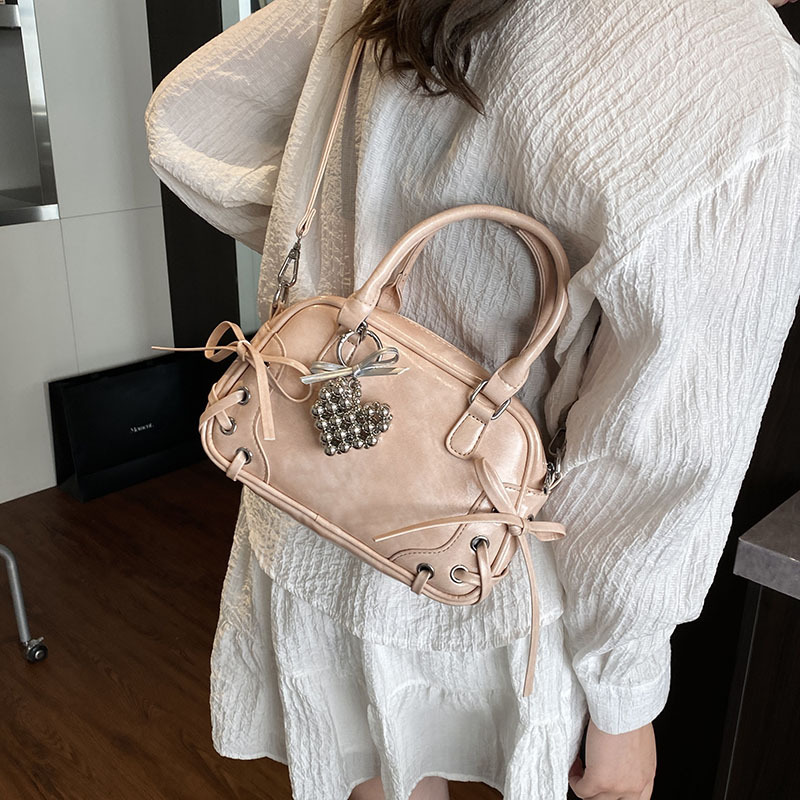A stylish and sweet bow hand-held Boston bag for women, a new style of high-quality commuting versatile single-shoulder crossbody bag for 2025 details Picture