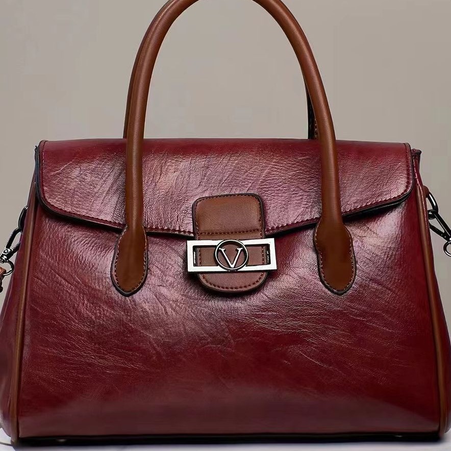 A new Korean-style stylish commuter women's bag for foreign trade, with a large capacity, fashionable and simple design, hand-held shoulder, and a soft leather-like tote bag details Picture