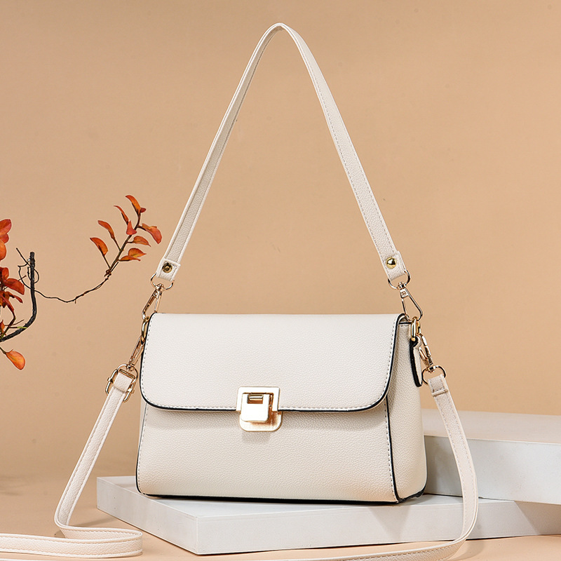 The new 2025 simple crossbody bag with lychee pattern for middle-aged moms is a must-have for shopping and grocery shopping. It's a trendy lock shoulder bag details Picture