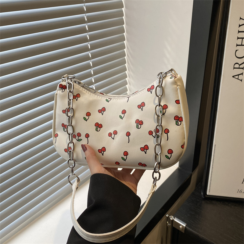 French niche underarm bag for women, new summer 2025 fashionable printed handbag, urban simple hand-held bag full figure