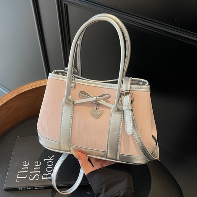 A niche high-end handbag, 2025 new style bow bucket bag, printed color-blocking single-shoulder bag, stylish crossbody bag full figure