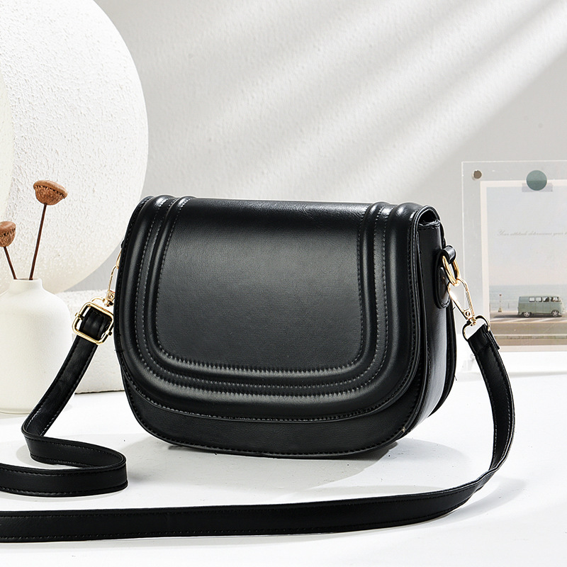 The 2025 new saddle bag women's bag features a niche design. It is a solid-color flip-top embossed fashionable women's crossbody bag details Picture