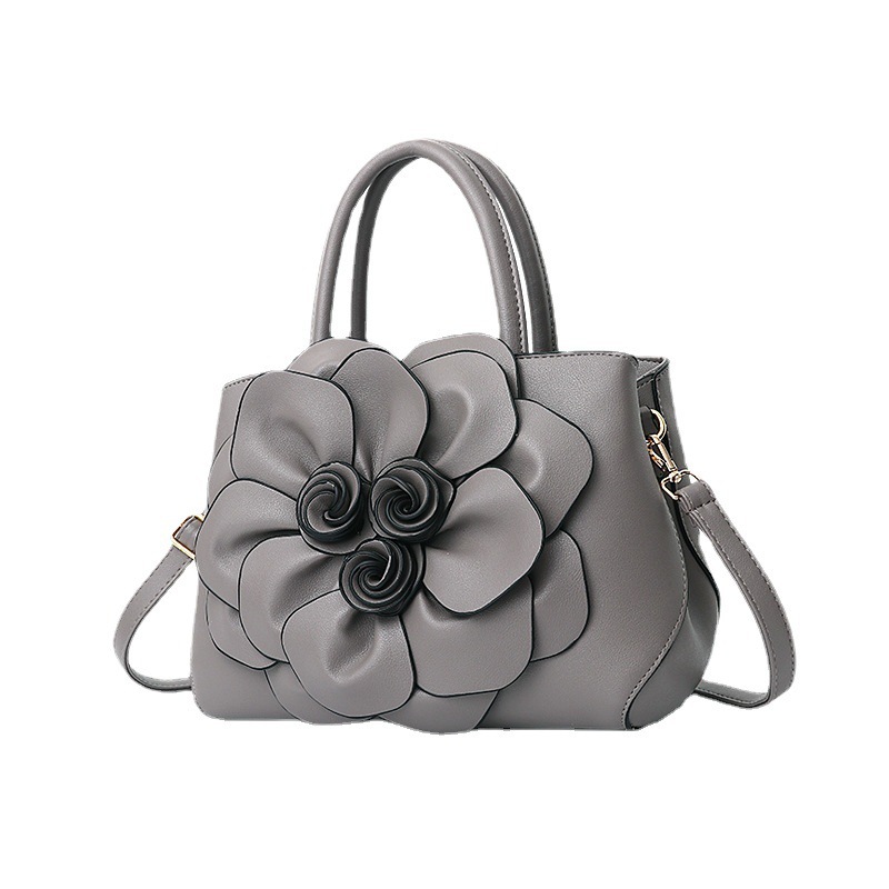 Mom's solid color new school-style women's bag, PU leather flower hand-held shoulder bag, cute bag, one piece consignment Item Picture