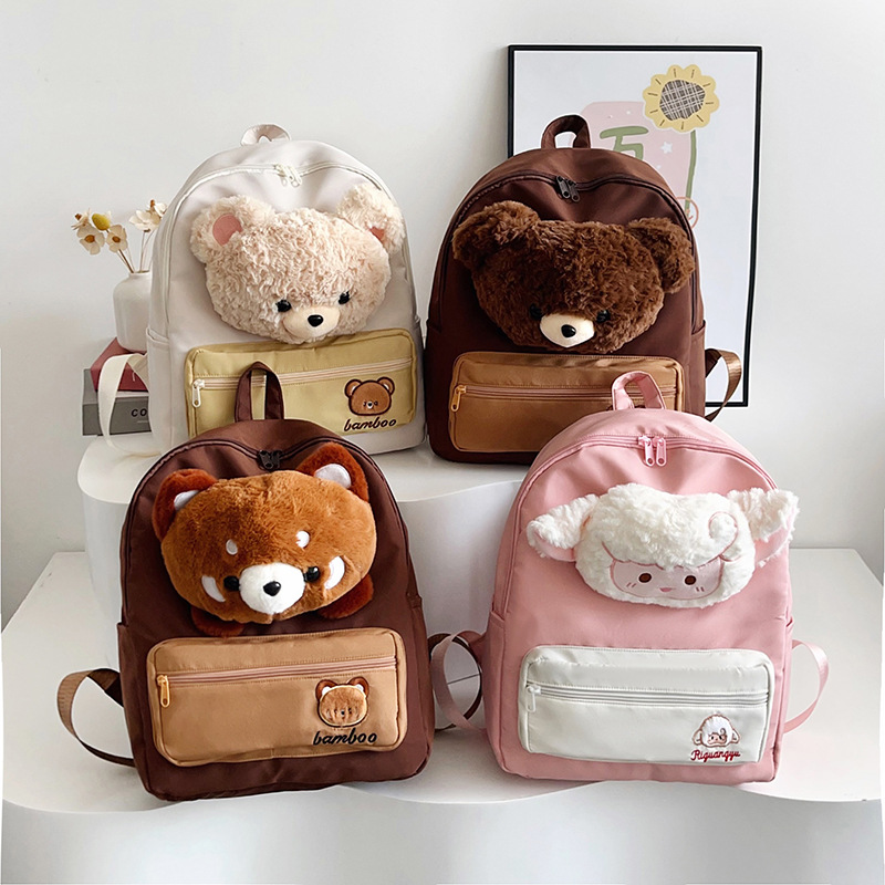 The new cartoon bear canvas backpack is cute and has a large capacity. It's a student class backpack with a girlish heart and a little lamb style full figure