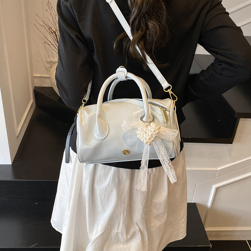 This is a trendy Boston handbag designed for women in 2025. It is a simple and versatile solid color single-shoulder crossbody bag for summer details Picture