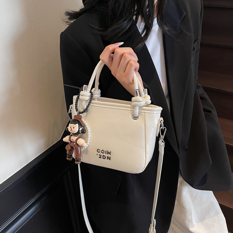 Retro solid color letter hand-held bucket bag for women, 2025 new style, high-end texture, versatile and stylish single-shoulder crossbody bag details Picture