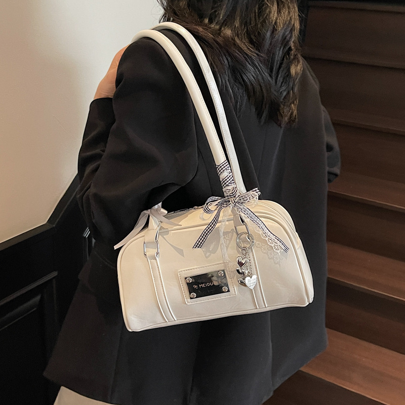 Trendy and versatile hand-held bowling bag for women 2025 New Korean version solid color casual and simple single-shoulder armpit bag full figure