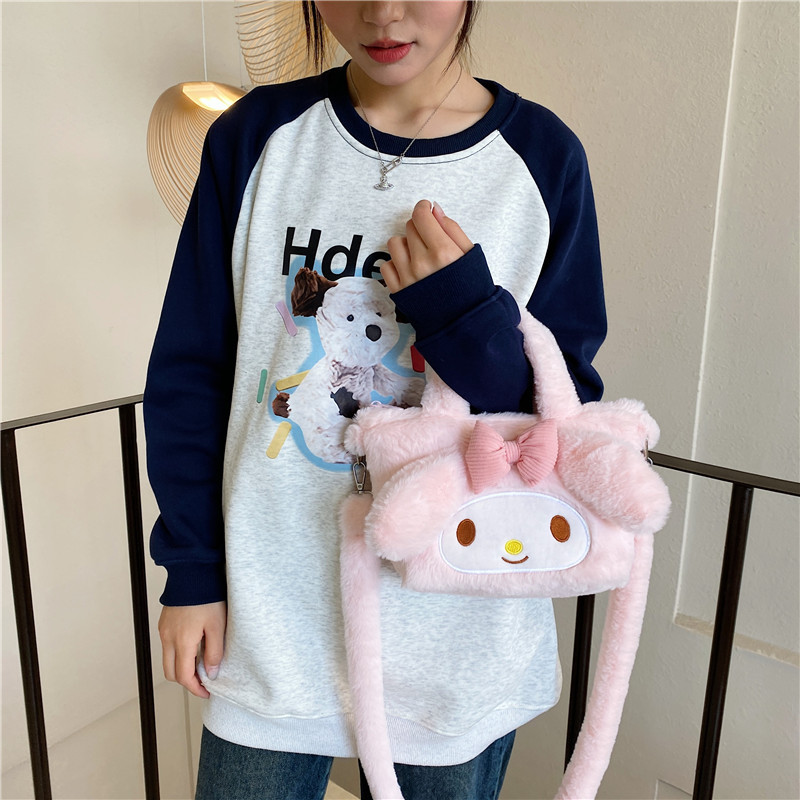 A cute cartoon hand-held crossbody small bag, a new pink rabbit furry single-shoulder bag, and a girls' hand-held bento bag details Picture