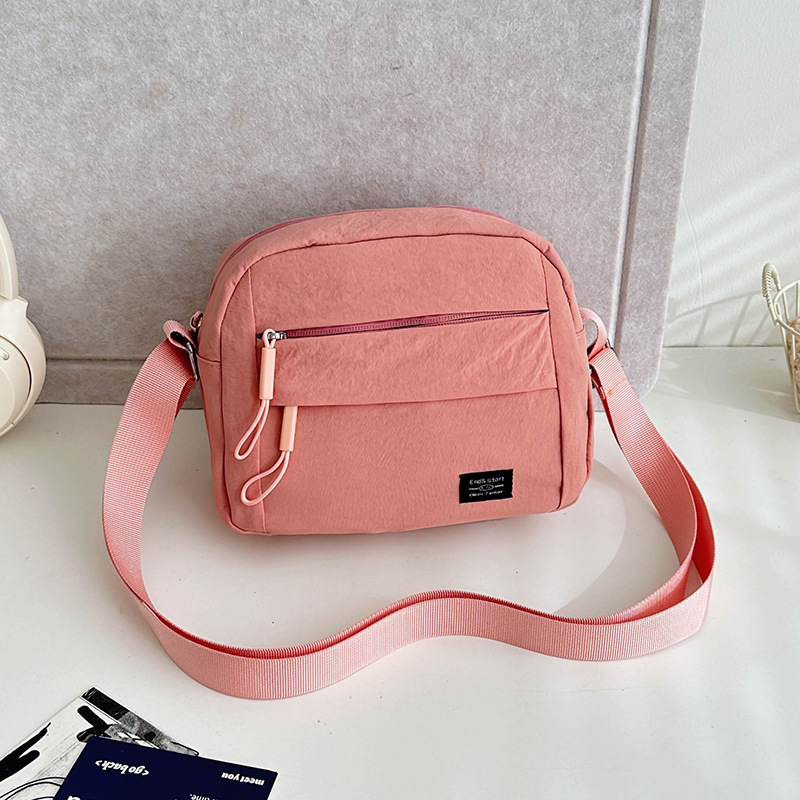 2024 New Korean-style casual and versatile women's crossbody single-shoulder canvas bag, middle-aged and elderly coin purse, solid color trendy women's bag details Picture