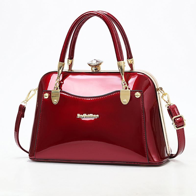Shiny leather steel frame bag, fashionable hand-held large bag, Taizhou women's bag 2023 new style, popular foreign trade single-shoulder bag, crossbody bag full figure