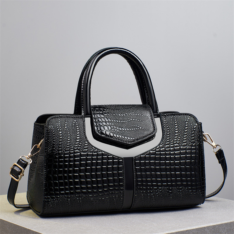 The new 2025 crocodile pattern women's bag is a fashionable crocodile pattern hand-held bag with a large capacity. It is a single-shoulder crossbody bag for middle-aged mothers full figure