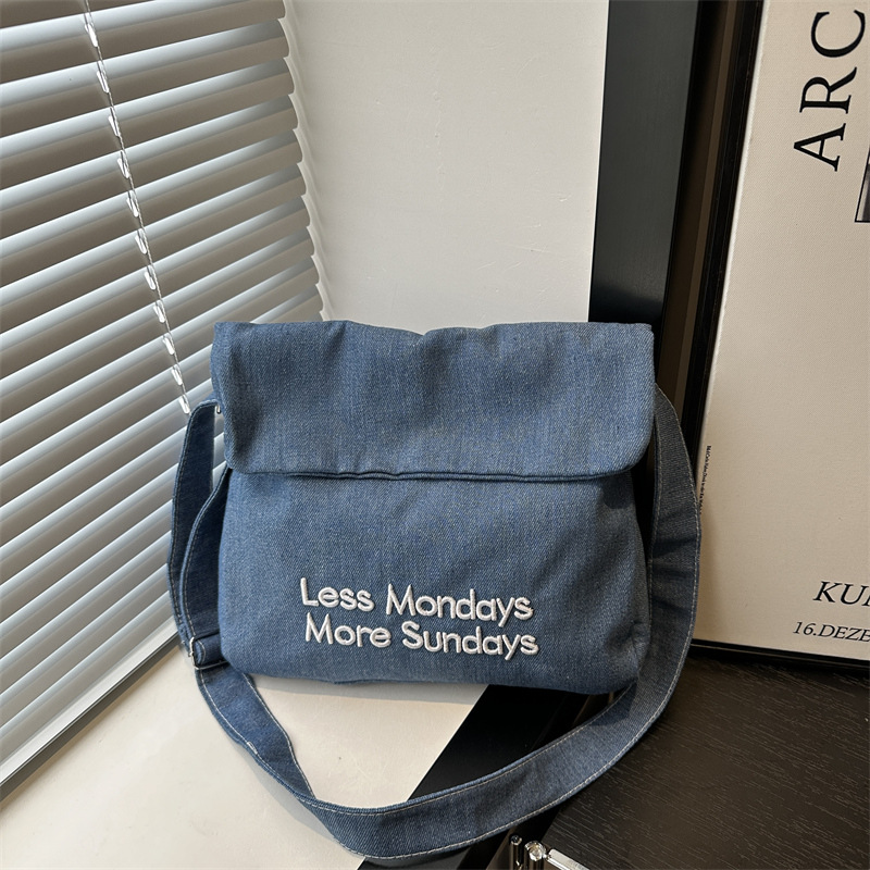 A new, stylish single-shoulder tote bag made of denim with letters in 2024, featuring a unique, trendy, simple, commuting, casual and artistic style full figure