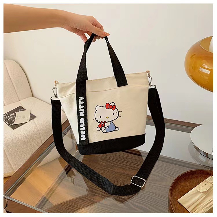 New cartoon canvas hand-held shoulder crossbody bag, cute office commuting document bag, bucket bag manufacturer wholesale version Specification drawing