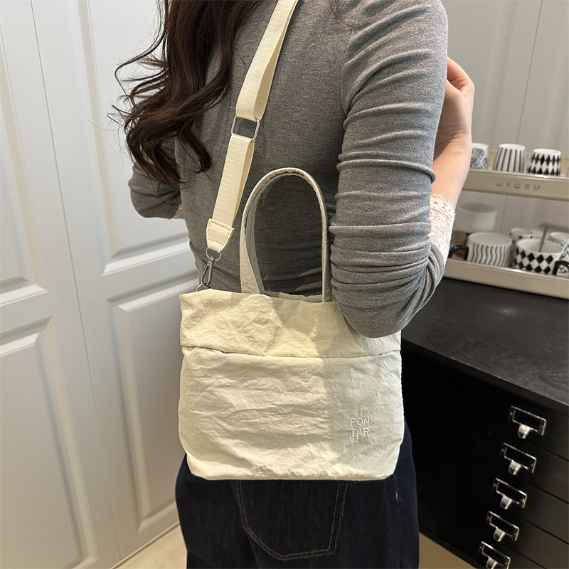 Simple nylon fabric bag for women, 2025 new style fashionable Korean version hand-held tote bag, versatile single-shoulder crossbody bag details Picture