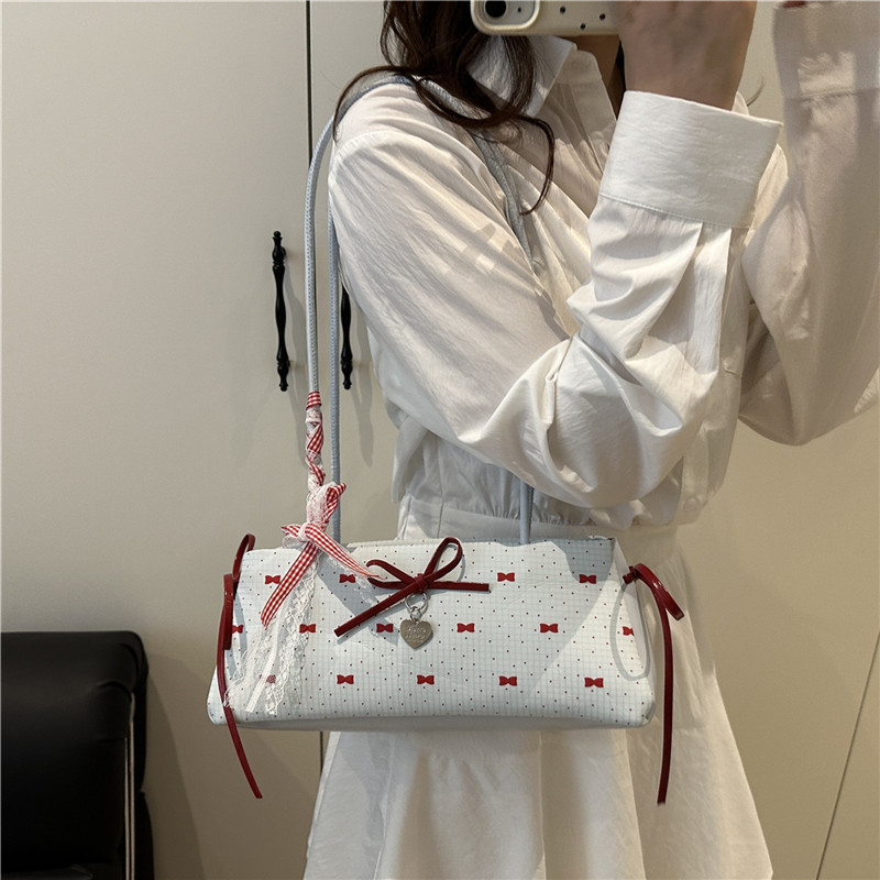 A niche color-blocking bag for women in 2025, a fashionable and versatile crossbody bag, a sweet and cool girl's hand-held bucket small bag details Picture