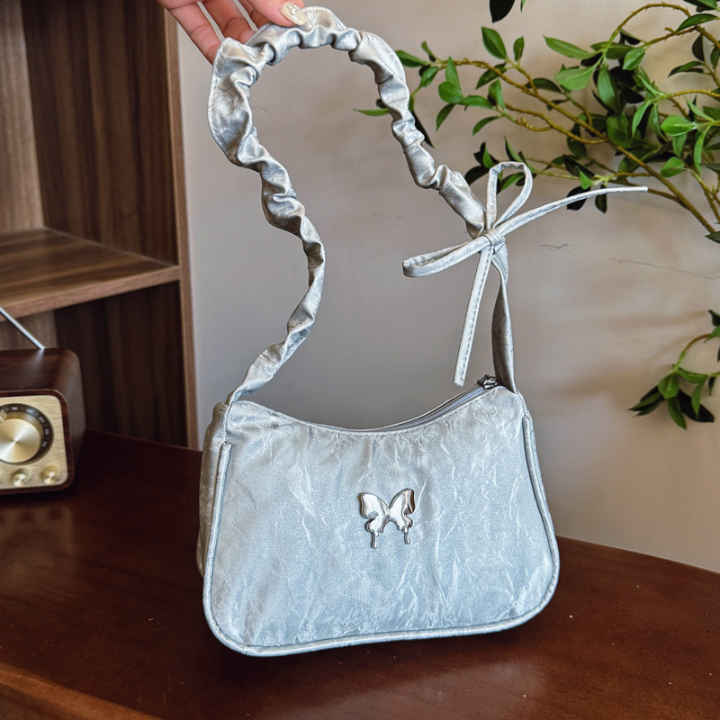The popular solid-color bow underarm bag 2025 new style simple and casual handbag with pleated, stylish and fashionable shoulder bag full figure