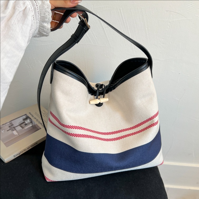 The new high-end canvas bag, striped bucket bag, large-capacity underarm bag, casual crossbody bag and patchwork single-shoulder bag are trendy full figure