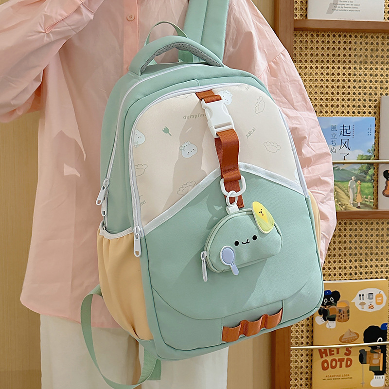 New minimalist color-blocking lightweight backpacks for boys and girls, schoolbags for primary school students in grades three to six, and outdoor backpacks details Picture