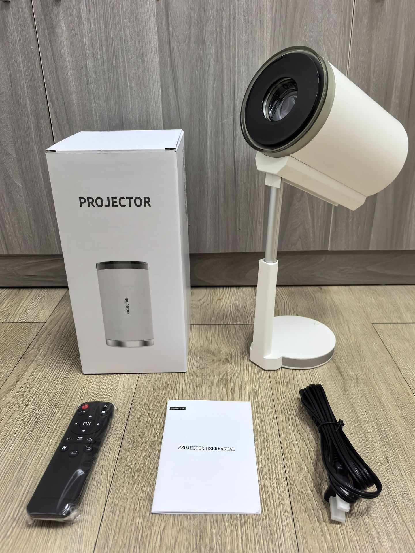 A best-selling home projector for foreign trade, featuring ultra-clear bedroom wall projection, direct projection of mobile phones and computers on the same screen, and a mini smart projector undefined